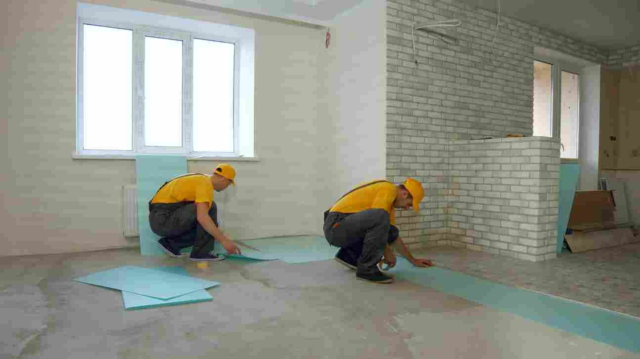 A man is insulating the floor of house